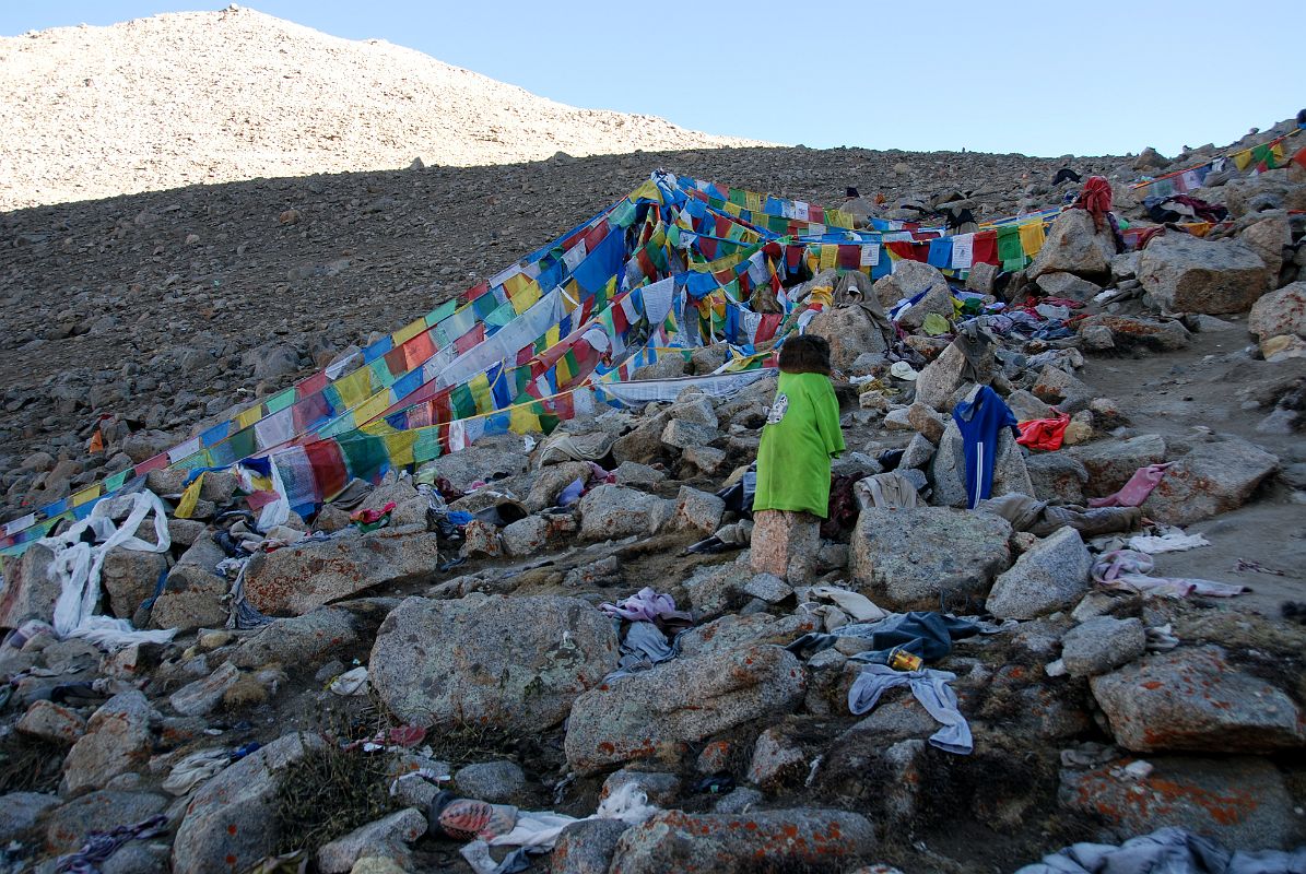 46 Prayer Flags And Pilgrim Clothing On Shiva Tsal On Mount Kailash Outer Kora Shiva Tsal (5371m) is a rocky expanse dotted with stone cairns draped with items of clothing. Pilgrims are supposed to undergo a symbolic death at this point, leaving their old life behind along with an item of clothing to represent it, a drop of blood or a lock of hair.